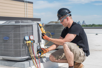 HVAC technician testing indoor unit